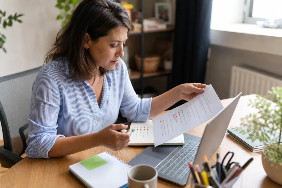 A job seeker comparing role requirements with personal experience notes